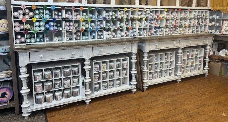 Paint wall with hundreds of pottery paint colors at CREATIVE paint-your-own pottery studio in Claremont, NC